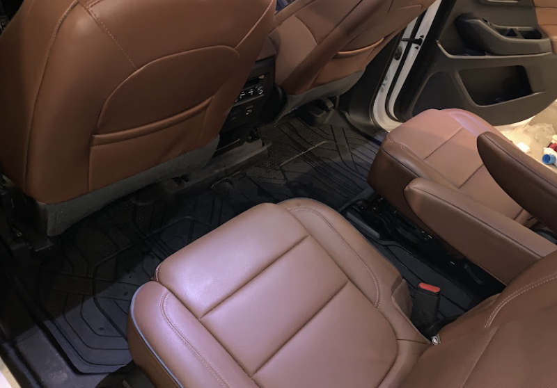 Freshly cleaned brown leather SUV seats after deep interior cleaning in Utah County