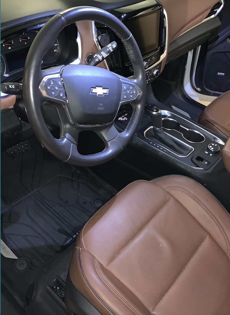Detailed brown leather interior and steering wheel after a mobile detail in Utah Valley