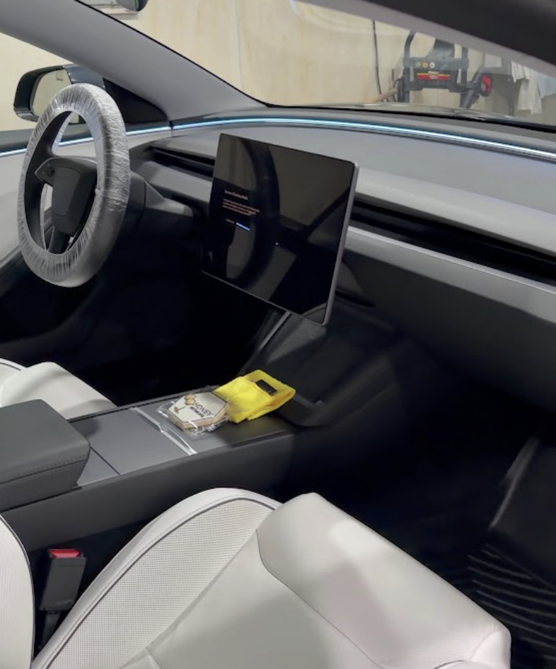 Tesla interior being detailed during a mobile appointment in Orem, Utah