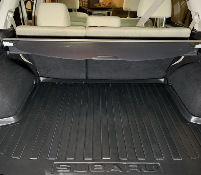 Cleaned Subaru cargo area with rubber mat after an interior detail in Utah Valley