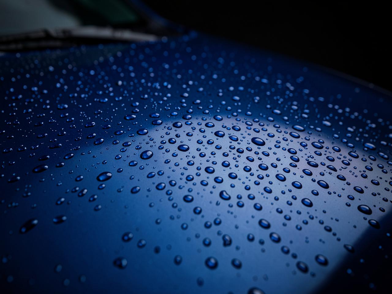 Water beading on a ceramic coated car hood after coating service in Utah Valley